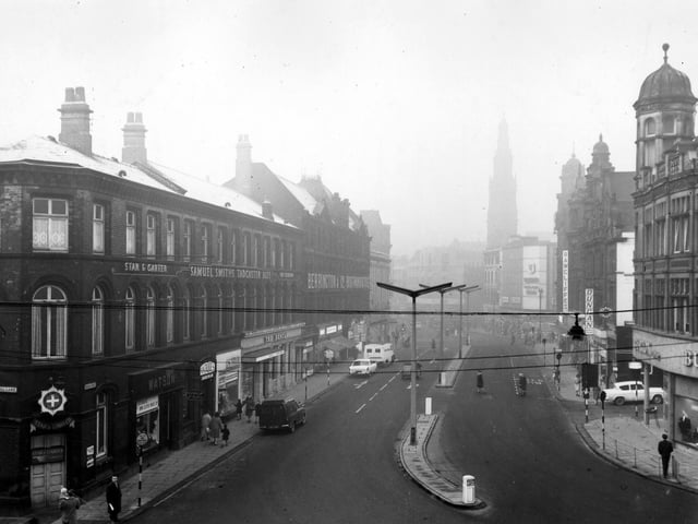 Duncan Street looking west towards Boar Lane, taken from the junction with Call Lane. On the left are two public houses, the Star & Garter and the Duncan. Shops in between include Watson tailors and W.W. Slee, antique dealer. Pictured in January 1964.