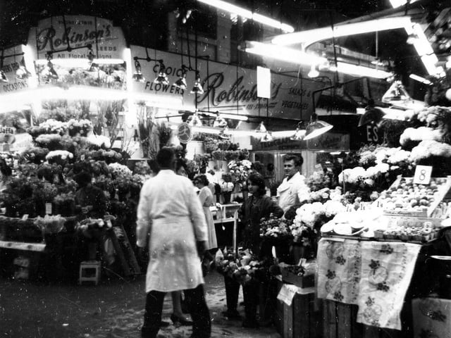Interior view of Kirkgate Market looking east and showing Robinson's Flower Stall. Pictured in 1964