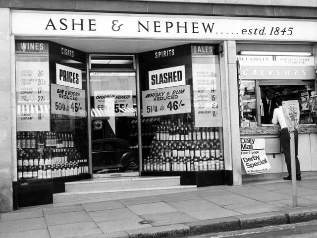 Ashe and Nephew, wine merchants on Albion Street. Posters in windows for reduced spirit prices. Tobacco Kiosk next door also sells newspapers. Pictured circa 1967.