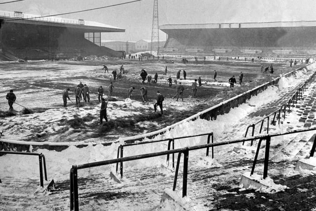 Snow is cleared off the pitch in the winter of 1969.