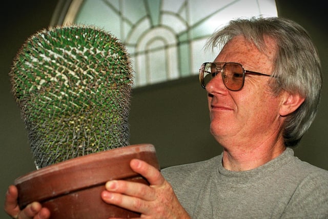 Cacti judge, John Henshaw, proprietor of Croston Cactus, studies one of the entries at the Chorley and District Gardening Society