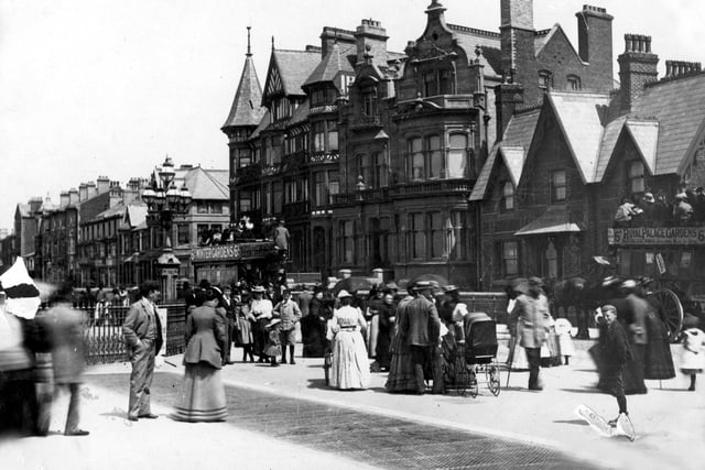 An injured soldier and a nanny with a baby carriage are among those enjoying the promenade close to its junction with Station Road , South Shore in the 1880s. On the right is the Holy Trinity Vicarage. The corner of Dean Street (with its mock Tudor panelling) is still recognisable