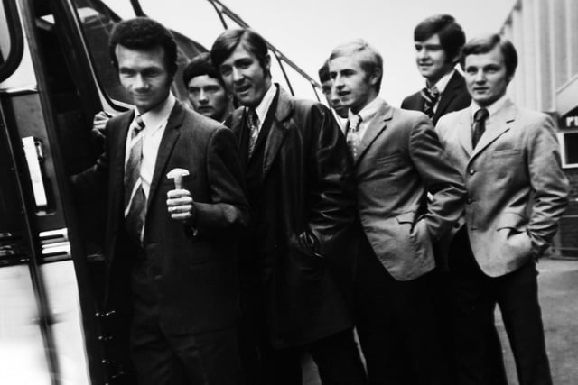Paul Reaney (front) gives a thumbs up as he heads onto the Leeds United team bus. (Varley Picture Agency)