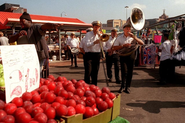 Members of the Phoenix New Orleans Parade Band entertain shoppers and stallholders at Kirkgate Market in August 1997.