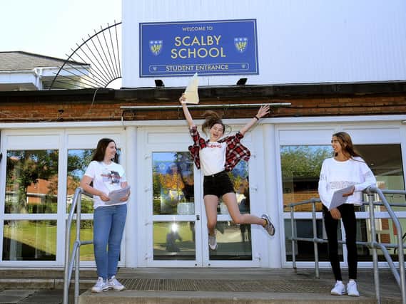 Ellie Palmer, Lily Roper and Sylvia Roca celebrate at Scalby School.