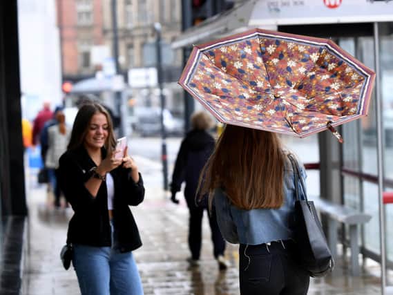 People battle the wind and rain in Leeds city centre