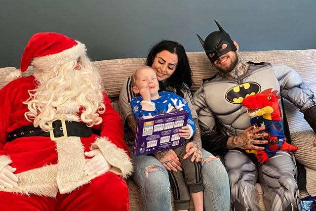 Laura and son Ellis had a visit from Batman and Santa on the day,