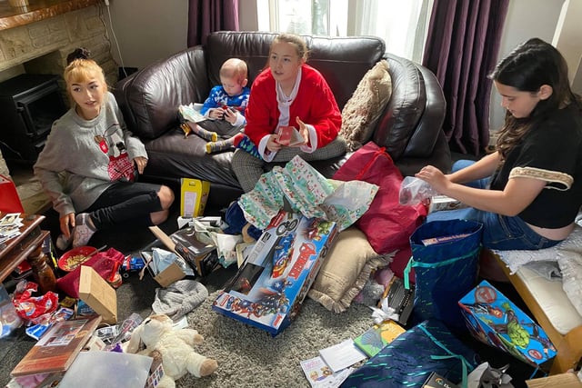 Ellis and his sisters unwrapped hundreds of gifts on the day.