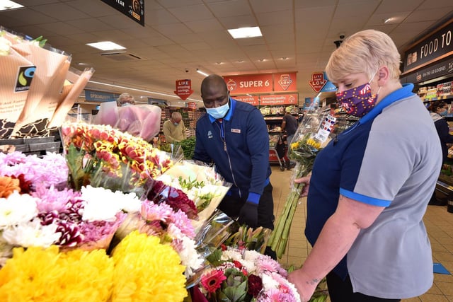 Simone Omogoriowo with Vickie Clarke arranging the fresh flowers.