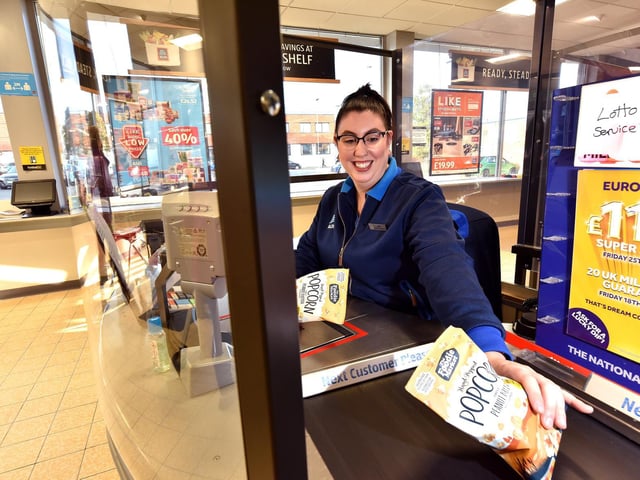 Amy Carter on the till.