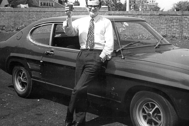 Wigan Observer journalist Geoffrey Shryhane with the first Ford Capri to be sold in Wigan, 1971.
