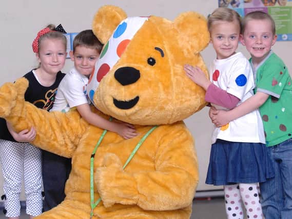 Children in Need mascot, Pudsey Bear, visited children at Sacred Heart Primary school, Springfield Road, Wigan for Children in Need, 2010.