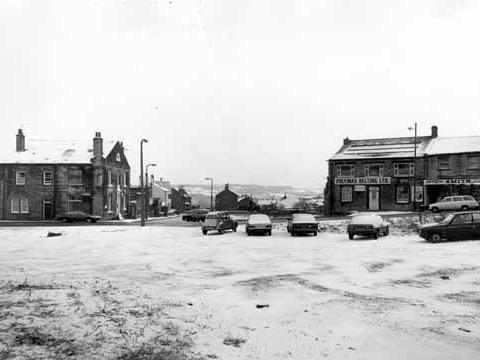 Looking across to Lowtown at the junction with Hough Side Road in January 1982.. On the left is the Victoria Hotel. To the right are Polymax Belting Ltd. and Charles Smith, greengrocer.