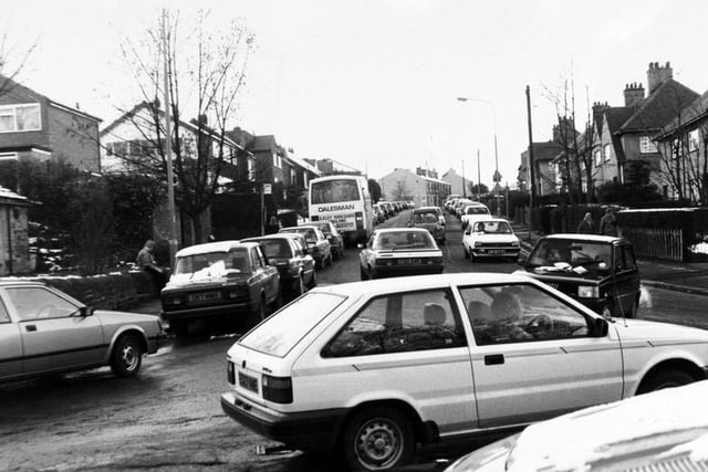 The chaotic scene in Fartown as traffic builds up and vehicles park waiting to pick up pupils from Fulneck School at the end of the school day in November 1988.