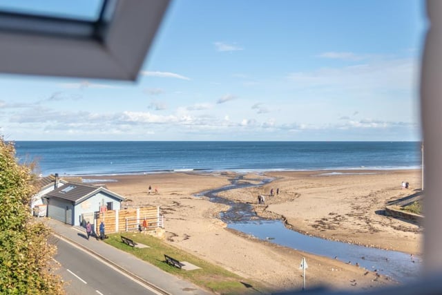 Long range views of the beach and out to sea from a second floor window