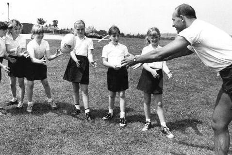 Schoolgirls in Featherstone being coached in Rugby League