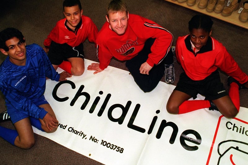 Leeds United's David Batty helped to receive a cheque from M&S on behalf of children's charity Childline. He is pictured with pupils from Primrose High School, Syed Ahsan, Matthew James and Delana Morton.