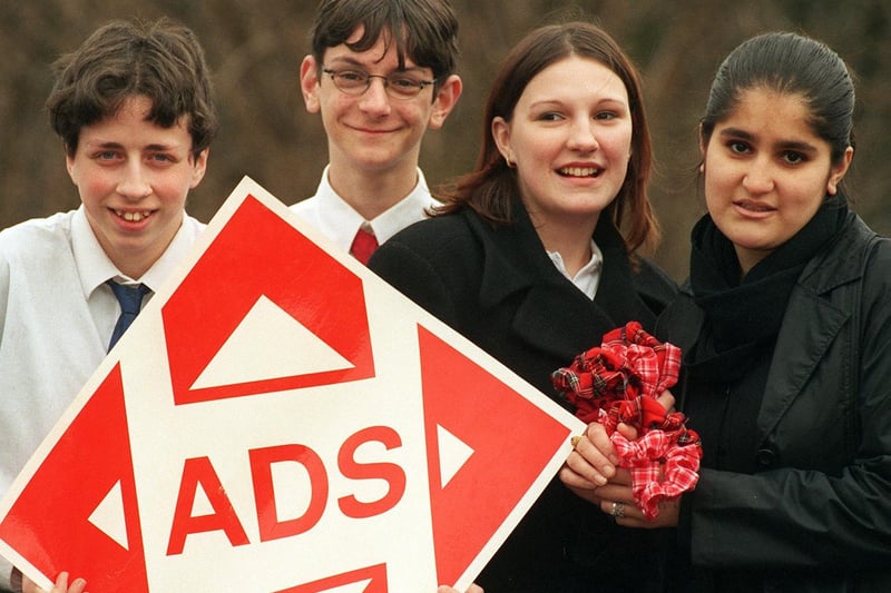 Pupils from Cockburn High School who set up two young enterprise companies. Pictured are Mark Williamson (left) and Mathieu Ward with a logo of their firm as, right, Nicola Tansey and Adeeba Akhtar hold some of their hair products.