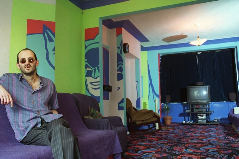 This is Peter Master who is featured relaxing at home in Headingley in one of the many rooms covered in Batman artwork.