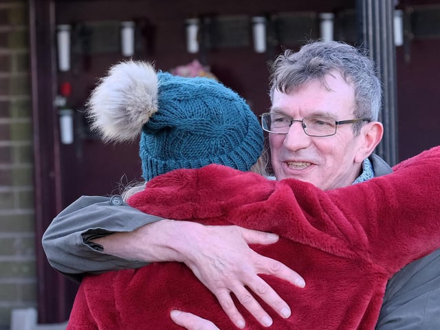 Barry's son Chris greets friends.