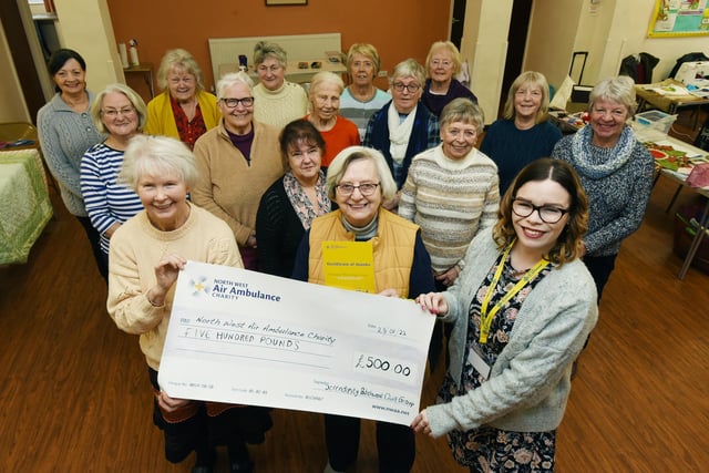 Members of Serendipity Quilters present a £500 cheque to Laura Carr, right, South Lancashire regional fund raiser at North West Air Ambulance Charity, the funds were raised by selling spare material in the group and in lieu of Christmas cards to each other.