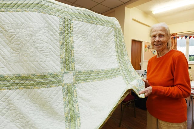 Kath Fletcher with her hand-stitched blanket which took years to create.