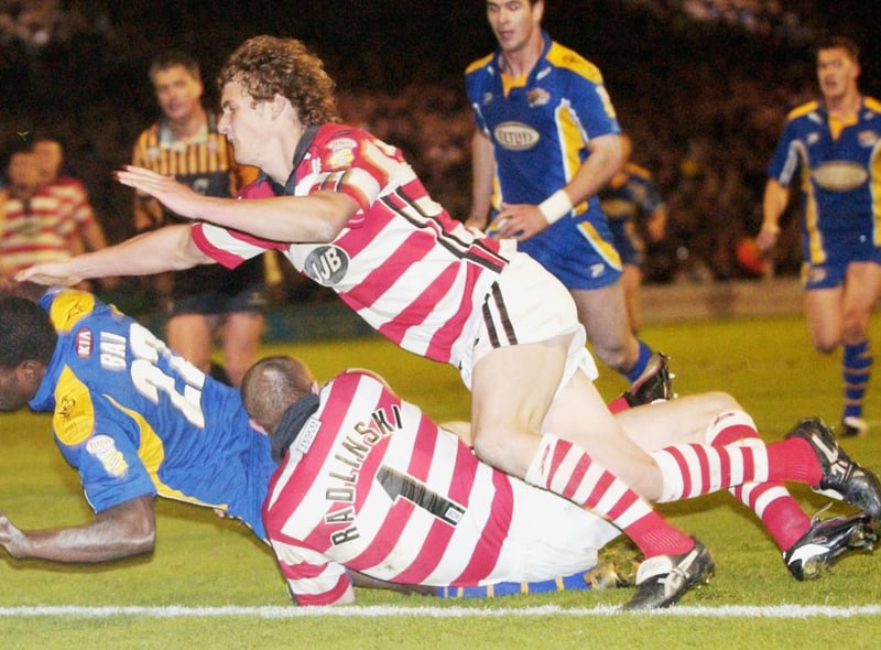 LEEDS, ENGLAND - OCTOBER 8:  Marcus Bai of Leeds dives over to score a try during the Super League Final Eliminator match between Leeds Rhinos and Wigan Warriors at Headingley on October 8, 2004 in Leeds, England.