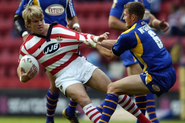 WIGAN, ENGLAND - JUNE 19:  Gary Connolly of Wigan is tackled by Danny McGuire of Leeds during the Super League match between Wigan Warriors and Leeds Rhinos at The JJB Stadium on June 19, 2004 in Wigan, England.