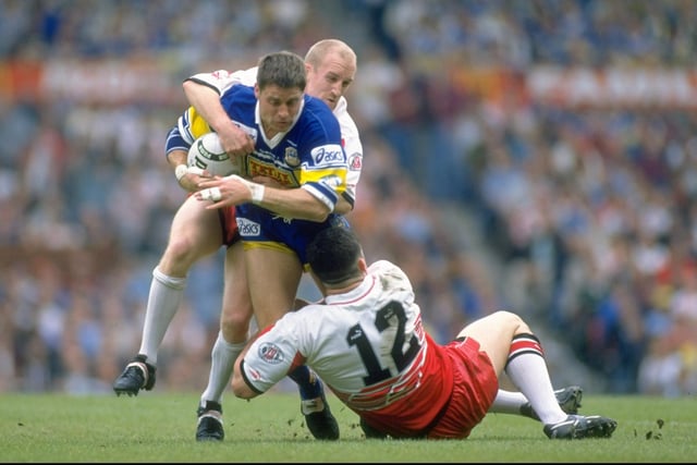 21 May 1995:  Alan Tait of Leeds is tackled by Shaun Edwards and Andrew Farrell of Wigan during the Division One Premiership final at Old Trafford in Manchester, England.