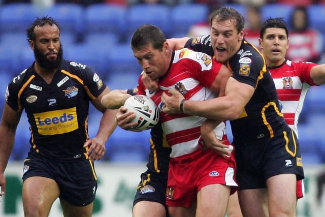 WIGAN, UNITED KINGDOM - JULY 12:  Gareth Hock of Leeds is tackled during the Engage Super League match between Wigan Warriors and Leeds Rhios at the JJB Stadium on July 12, 2007 in Wigan, England.