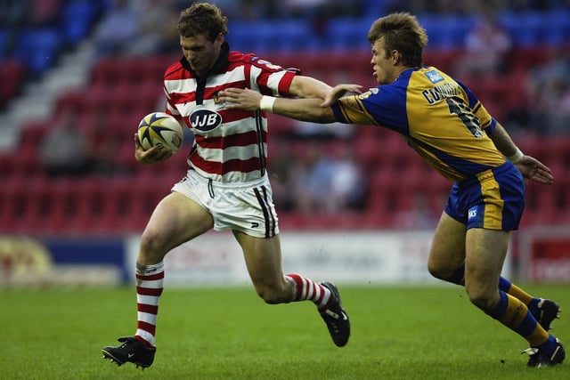 WIGAN - 30 MAY 2003:  Sean O'Loughlin of Wigan Warriors hands off Gary Connolly of Leeds Rhinos during the Tetley's Super League match between Wigan Warriors and Leeds Rhinos held on May 30, 2003 at The JJB Stadium, in Wigan, England. Leeds Rhinos won the match 30-20
