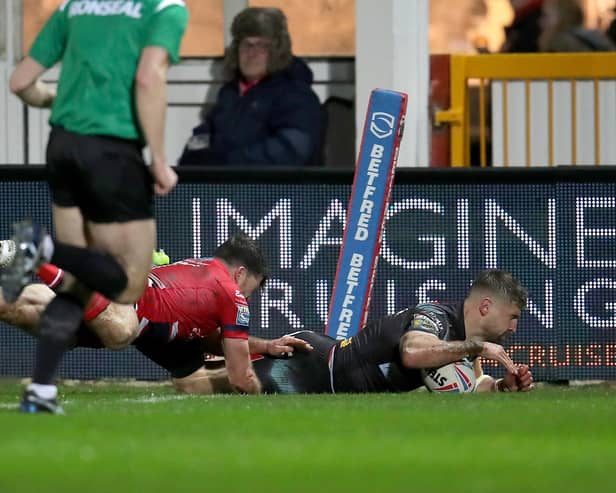 Too good: St Helens' Tommy Makinson (right) scores one of his hat-trick of tries in the win over Hull KR. Picture: Simon Marper/PA Wire.
