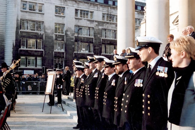 Commissioned Officers from the Ark Royal in full ceremonial dress decorated with medals. Officers are lined up outside the Civic Hall.