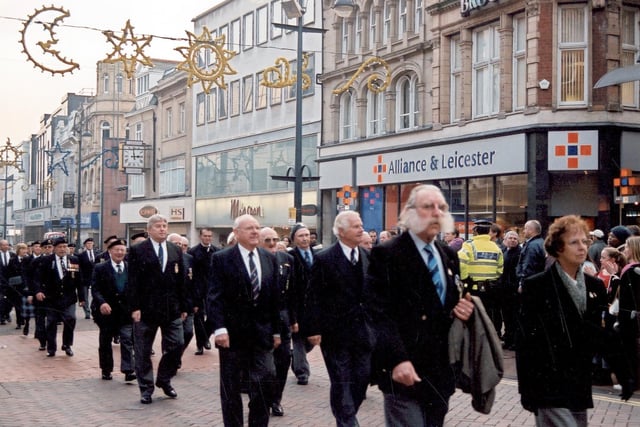 Veterans from the Royal Navy Association and the British Legion march up Briggate. These men and women, many of them decorated with numerous medals, were taking part in the ceremonial parade.