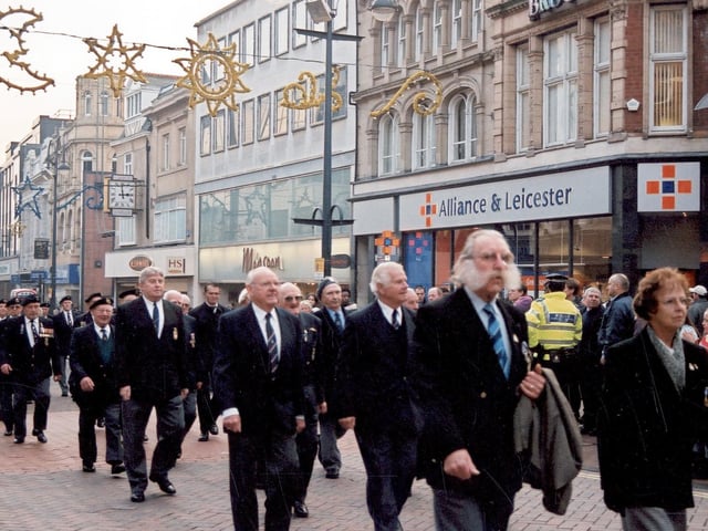 Veterans from the Royal Navy Association and the British Legion march up Briggate. These men and women, many of them decorated with numerous medals, were taking part in the ceremonial parade.