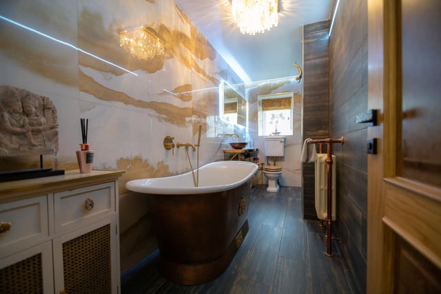 Luxurious is the word in this bathroom with its deep copper bath, walk in shower, tv and under floor heating.