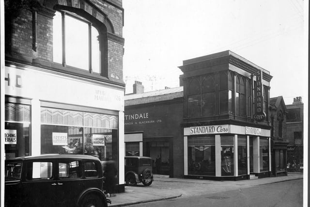 Albion Street in September 1935. Pictured on the left is Rex Holliday artists supplies. Next junction with St Anns Street with garage and car showroom 'Standard Cars'.