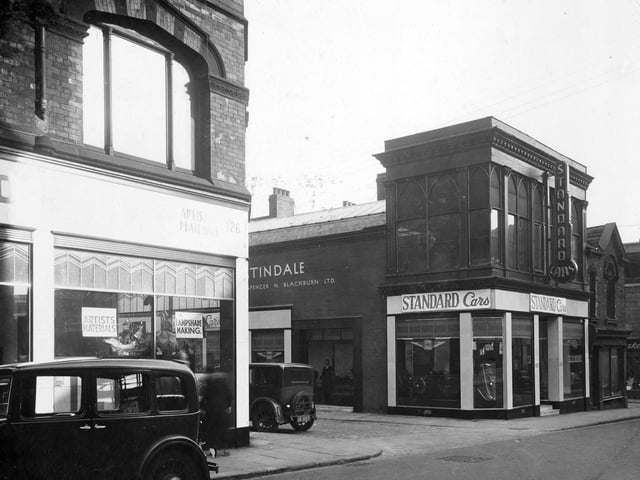 Albion Street in September 1935. Pictured on the left is Rex Holliday artists supplies. Next junction with St Anns Street with garage and car showroom 'Standard Cars'.