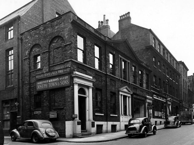 The junction of Albion Street and Butts Court (on the left) in August 1949. The premises are G.L. Barker, accountant; J.W. Bulmer, tailor and Hindle, Son & Lewis, estate agents. On Butts Court are the premises of Wiggins, Teape & Alex Pirie Ltd, paper makers, and Allied Paper Merchants Ltd. (Joseph Towne & Sons).