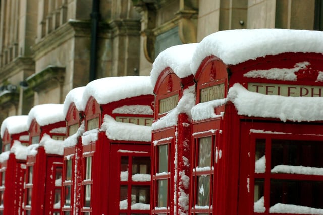 Snow covers the iconic row of red telephone boxes in Preston city centre during the winter of 2010