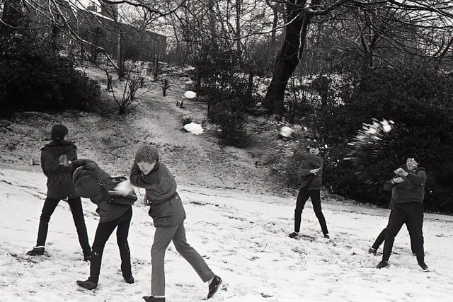 This picture, taken on January 23, 1984, shows a group of teenagers taking advantage of the snow, enjoying a cheeky snowball fight