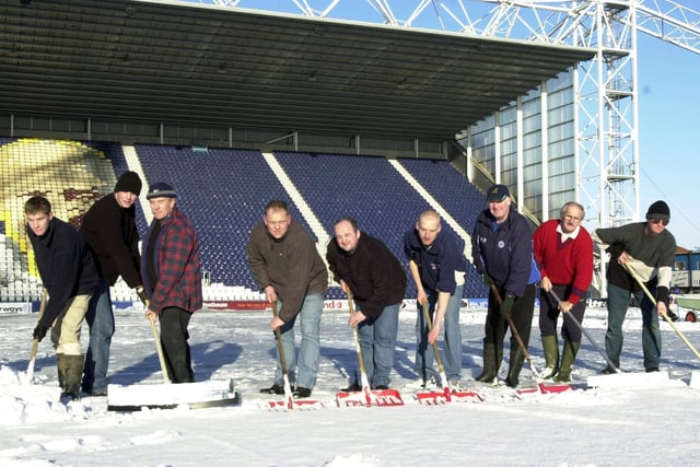 During the busy Christmas fixture list for Preston North End these volunteers clear snow from the pitch at Deepdale during the winter of 2000