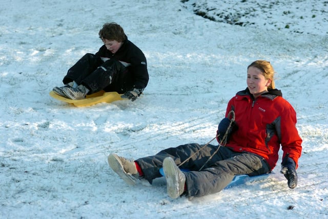 On Boxing day 2004 Aimee Capstick, 16, and brother Robert, 11, enjoy the snow in Miller Park, Preston