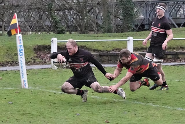 Michael Briggs scores for Old Brodleians. Picture: Robin Sugden