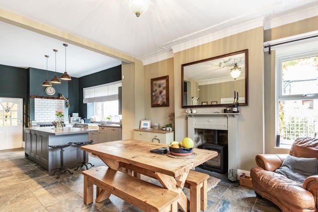 The dining space features an attractive fireplace with log burning stove as well as plenty of space for the family to sit back, relax and enjoy a meal.
