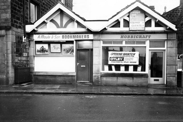 Ivegate in December 1980. These are small, one storey buildings with gables, sandwiched between more substantial stone built properties including the Crown Public House, off camera, right. Pictured is bookmakers, A. Moule & Son and an empty Hobbicraft shop which was bein g replaced with a new branch of Otley Building Society.