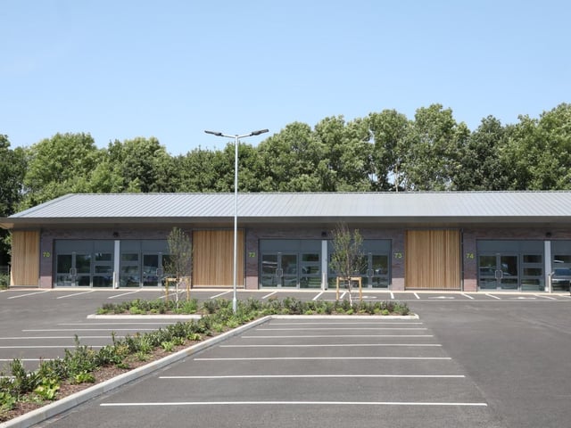 This picture shows part of the car park and some of the workshop spaces