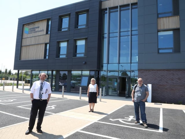 ENC leader Cllr Steven North, centre manager Fiona Wells and the council's head of economic development Greg MacDonald outside the centre