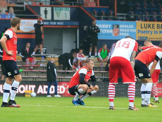 Luton Town's players react to yesterday's 1-1 draw with Barnsley