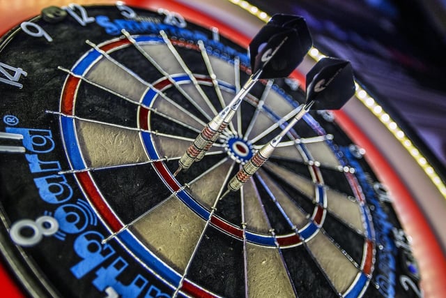 Channel your inner Phil 'The Power' Taylor at Caddy Shack's darts board